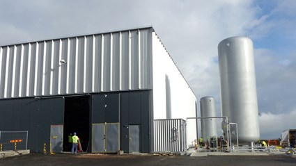 The Cryo Building at ESS in Lund, contains compressors for helium gas, stored in large outdoor tanks. The helium gas is cooled down to 2 Kelvin (K) and then transforms into liquid form, making the accelerator tunnel superconductive.