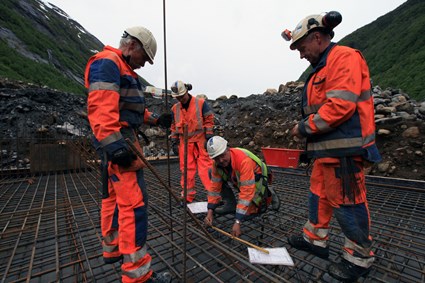 Blue collars at work with the  concrete formwork